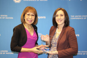 Angie Soety receives an award from Mayor Elizabeth Kautz